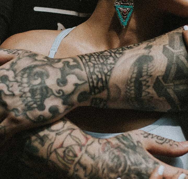 Tattoo artist at DanBam Tattoo Hoi An working on a client