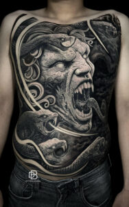 Medusa full stomach tattoo in black and grey realism style by DanBam Tattoo Studio in Hoi An⁠