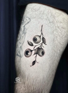 Black and grey rose tattoo on forearm by DanBam Tattoo in Hoi An, Vietnam