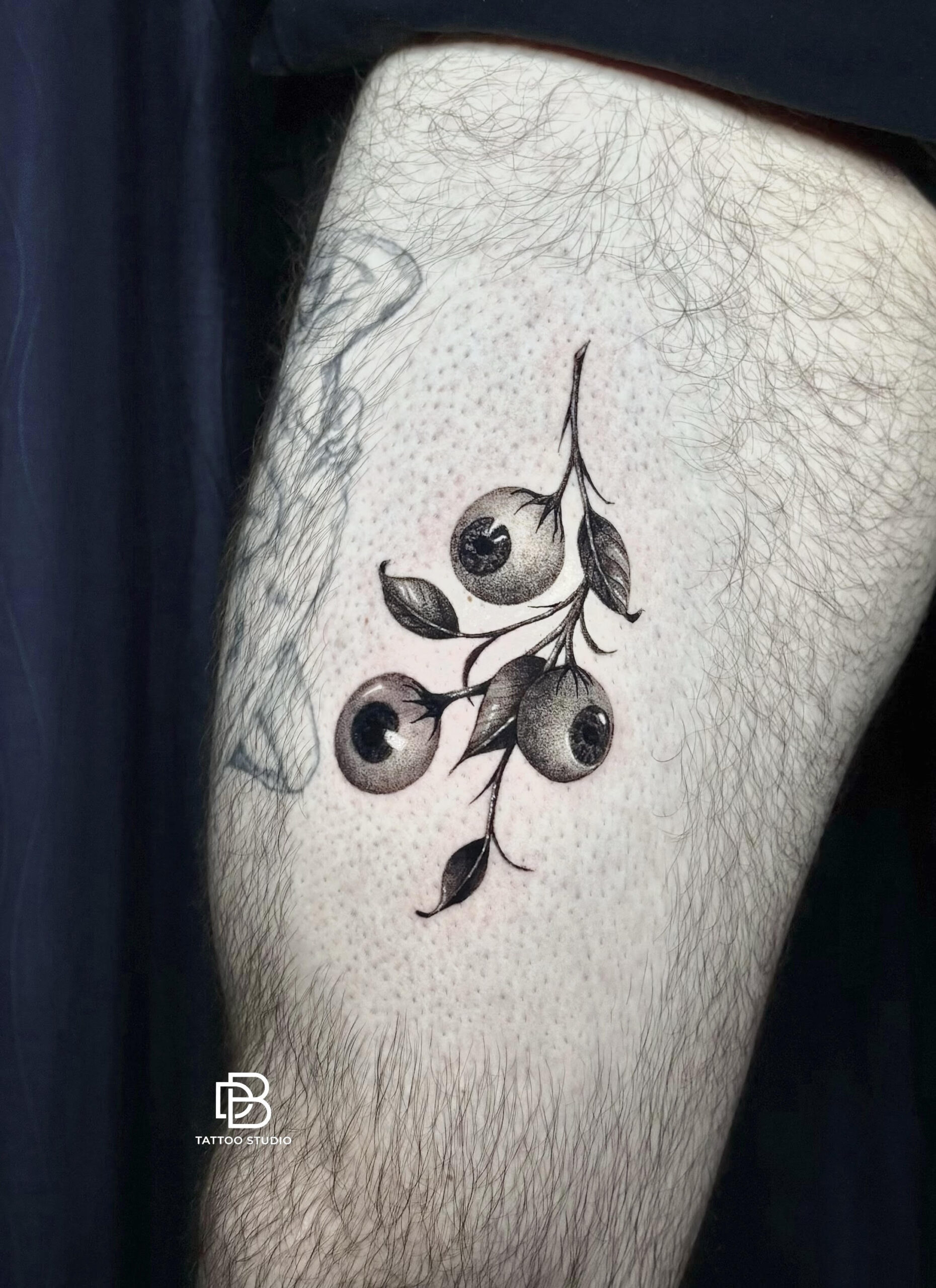 Black and grey rose tattoo on forearm by DanBam Tattoo in Hoi An, Vietnam