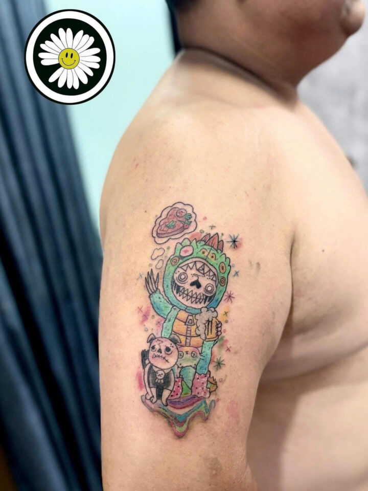 Colour astronaut character with a balloon tattooed on an upper arm