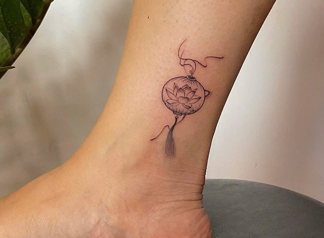 Small Hoi An lantern tattoo on an ankle