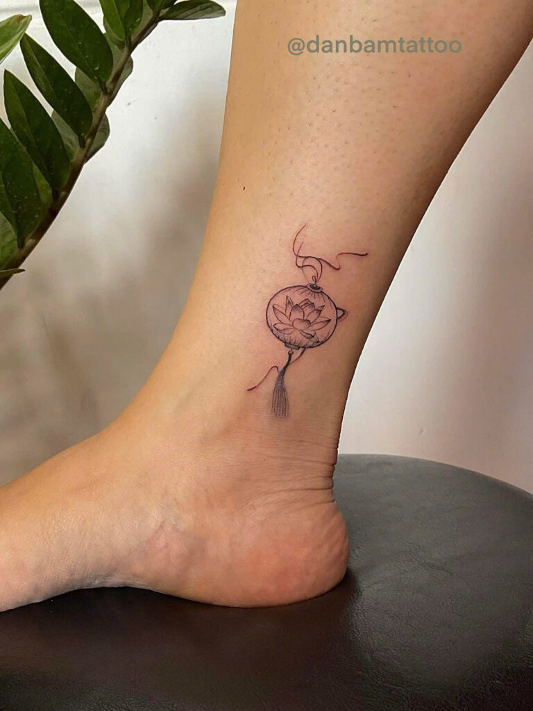 Small Hoi An lantern tattoo on an ankle