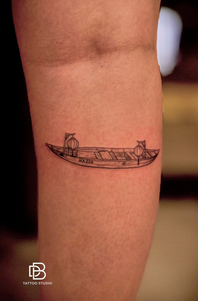 Fine line tattoo of a Vietnamese sampan boat with two rowers in conical hats