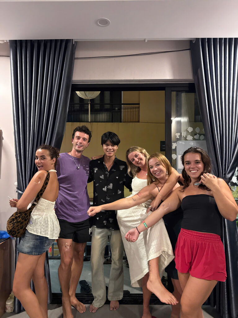 Clients posing together inside DanBam Tattoo Studio in Hoi An